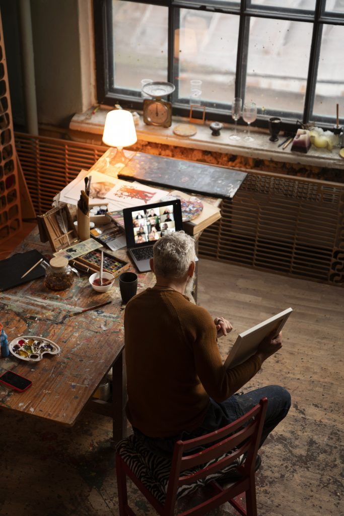 full shot man painting indoors
